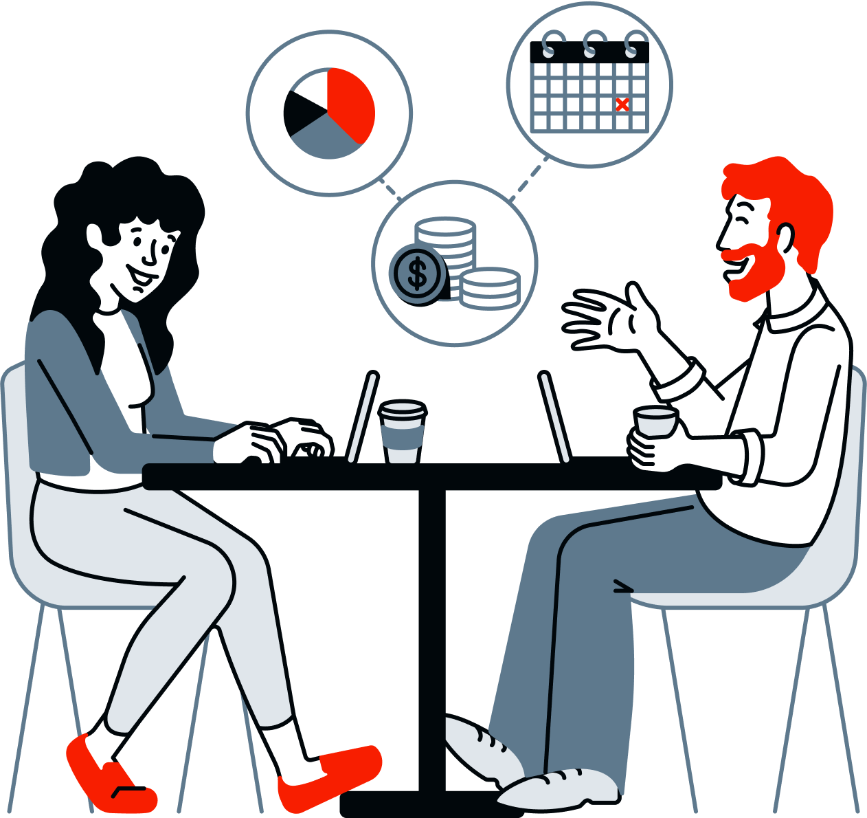 Two people talking across a small table, taking notes on laptops.